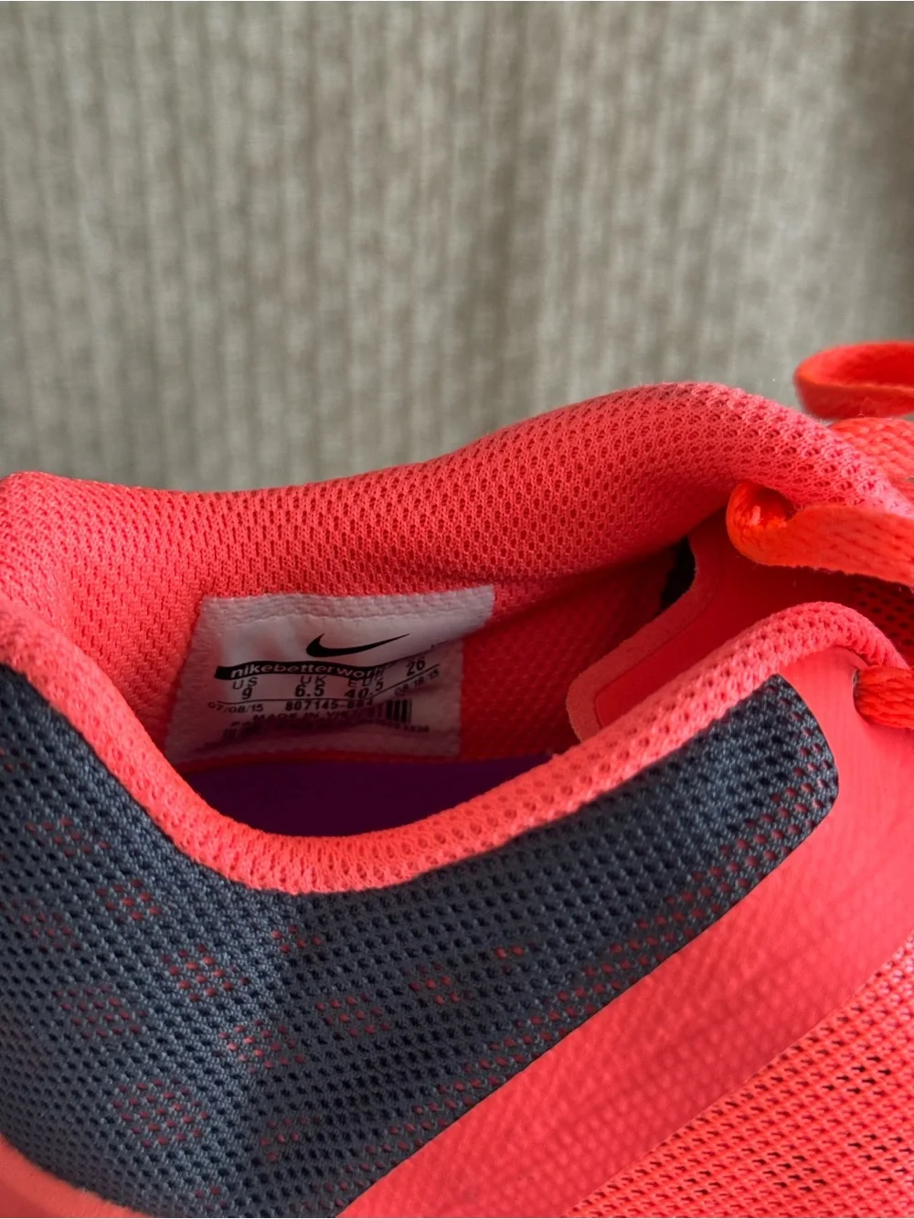Nike Women's Neon Orange Running Sneakers with Purple Swoosh